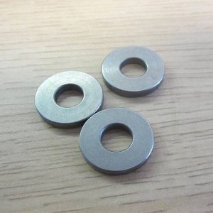 Flat stainless steel washers for load distribution and secure fastening.